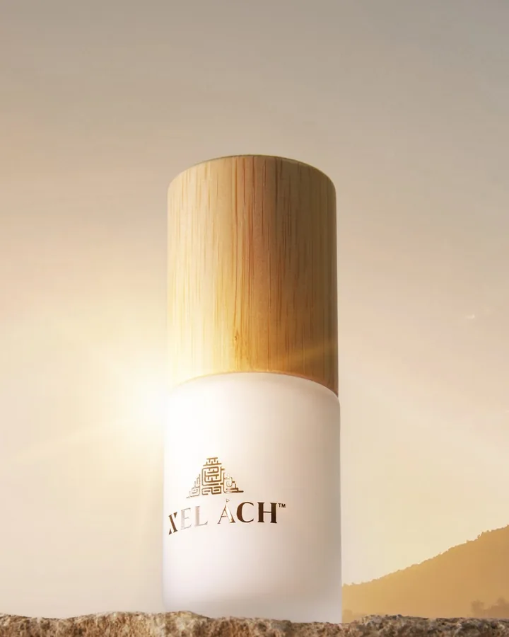 Xel Ách Citrus Boost C Serum bottle in warm light
